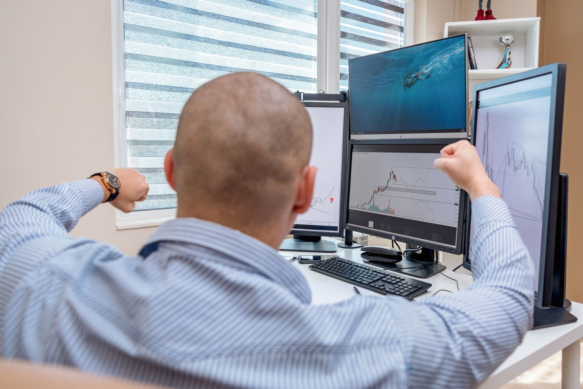 A founder at a multi-monitor desk, working through a lead pipeline
